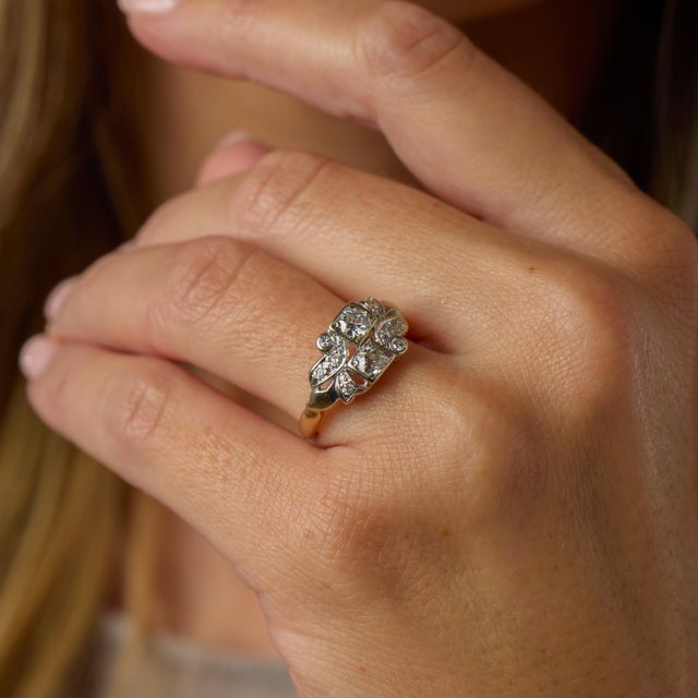 Retro old cut diamond 14k two tone gold ring is a beautifully detailed vintage design showcasing the bold elegance and...
