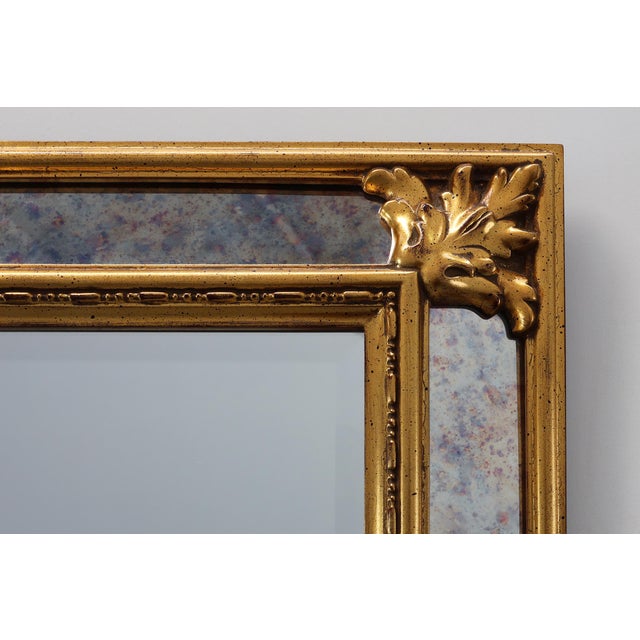 A richly ornamented Baroque‑style mirror by the renowned Belgian manufacturer Deknudt, crafted in the mid‑20th century and...