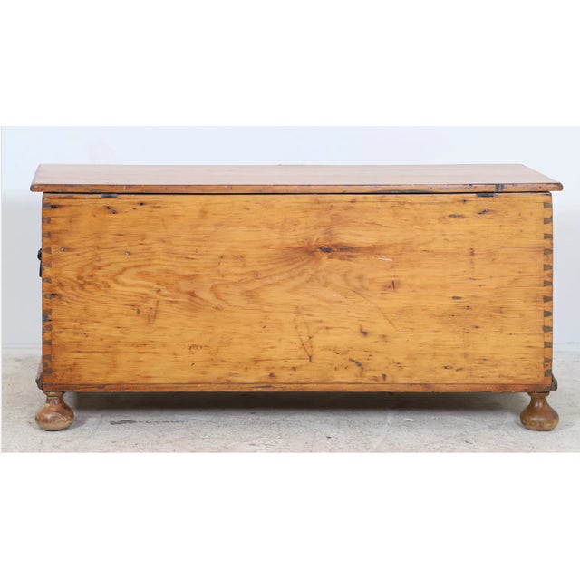 Antique cherry blanket chest, with dovetail corners. Interior til, iron handles, and escutcheon/key, on bun feet. 23"h x...