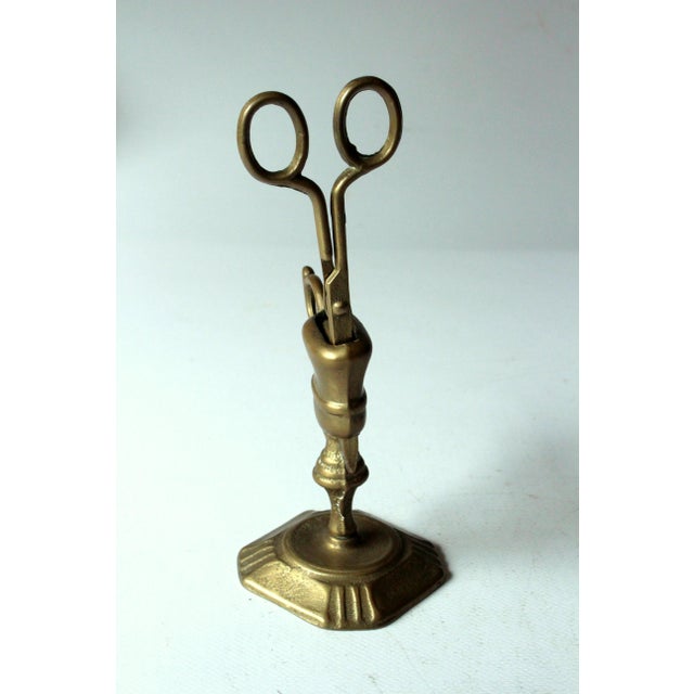 Brass candle snuffer with a brass stand as an extremely rare set - Vintage from the 60s - in excellent vintage condition...