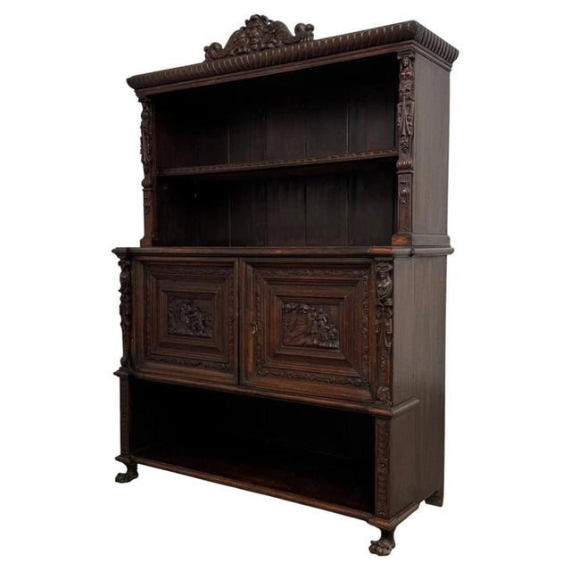 An exceptional and highly decorative 19th-century Victorian carved oak cupboard, combining remarkable craftsmanship,...