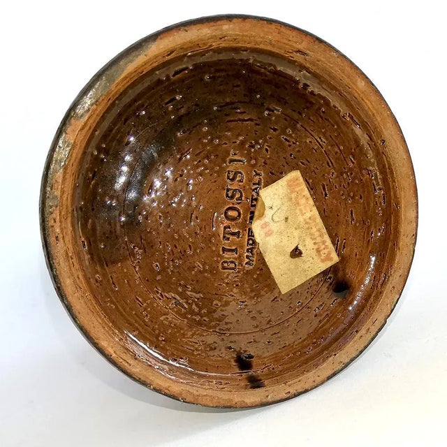 This vase or candlestick is made of ceramic brown and is signed Bitossi.