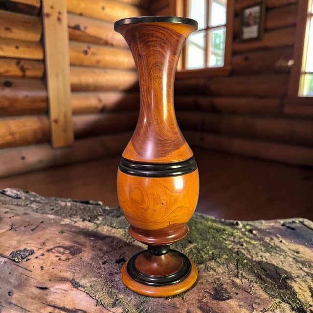 This vintage handmade turned wood floor table vase stands at a tall 24 inches, exuding a rustic charm that is perfect for...