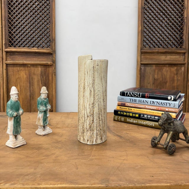 "About This Piece About This Piece This tall ceramic vase captures the raw poetry of the forest, with a surface that...