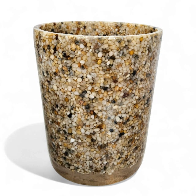 Bring a sculptural and earthy elegance to your entryway or bathroom with this striking Mid-Century Modern umbrella stand...