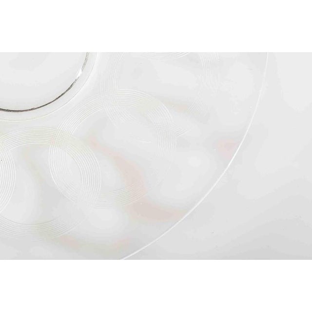 Vintage glass plate realized in Europe in the mid-20th Century. Finely decorated with delicate white circles. Very good...