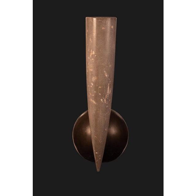 Silvestrin amphora in jurassic fossil stone by nerinea. Dimensions: w 40 x d 60 x h 118 cm. Materials: natural stone...