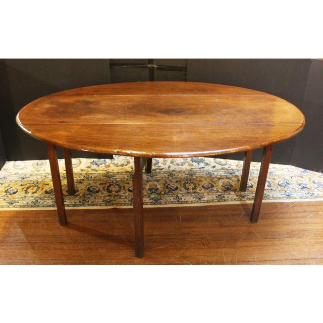 Circa 1765-1780 Irish wake table or hunt table. Drop-side form with swing leg supports. Heavy island mahogany timbers....