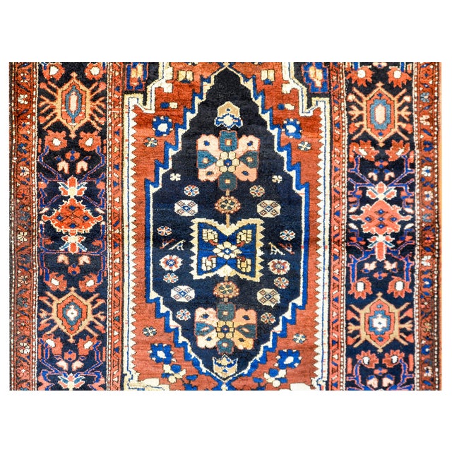 A wonderful early 20th century Persian Lori rug with a fantastic bold tribal pattern containing a large diamond medallion...