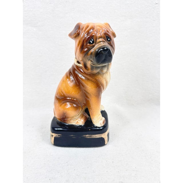 Add a touch of vintage mid-century charm to your shelves with this single ceramic Shar Pei dog figurine by Takahashi San...