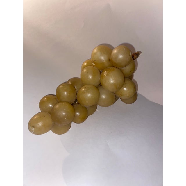 Lovely! Made in Italy Alabaster cluster grapes . Does have some weight Alabaster grape decor can be showcased in various...