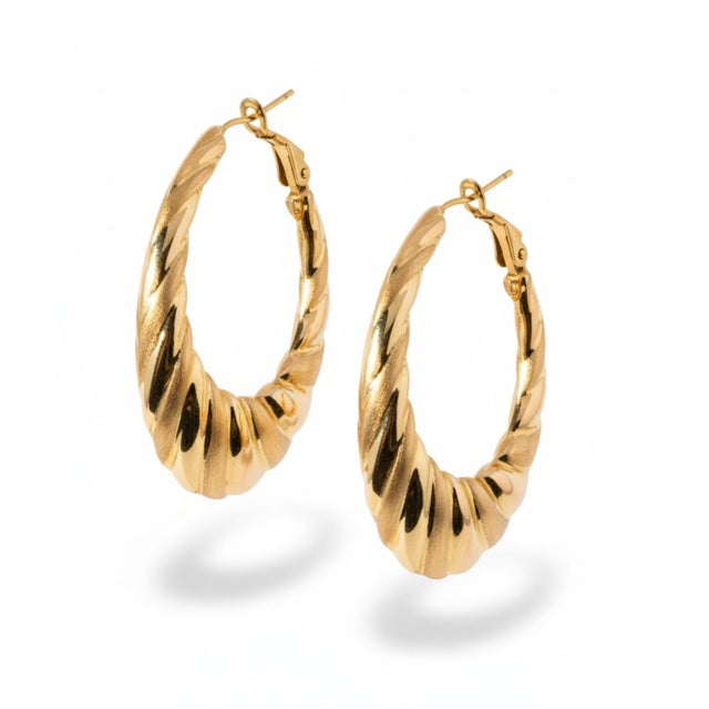 Elevate your jewelry collection with this striking pair of Italian 14 Karat yellow gold scalloped hoop earrings,...