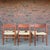 This is a beautiful set of 6 Danish, teak and rush dining chairs designed by Hans Wegner. The darker teak wood contrasts...