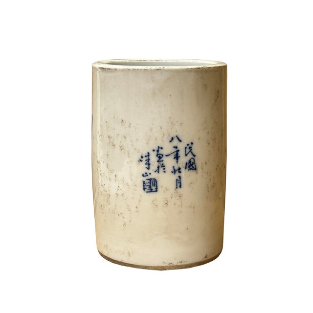 This vintage style Chinese blue and white porcelain brush pot (Bitong) showcases the refined artistry of the Republic...