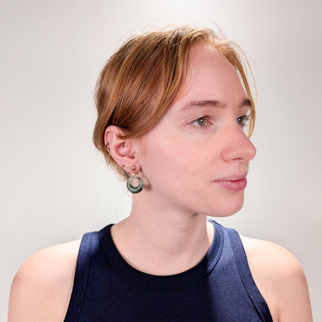 A fine pair of vintage Chinese jade & gold hoop earrings. In 14 karat yellow gold. Each with a tapered spinach jade...