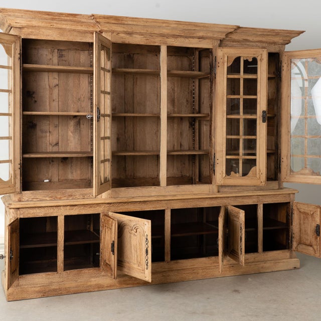 Large 20th century French bookcase crafted in oak which has been bleached providing a fresh feel to this large and stately...