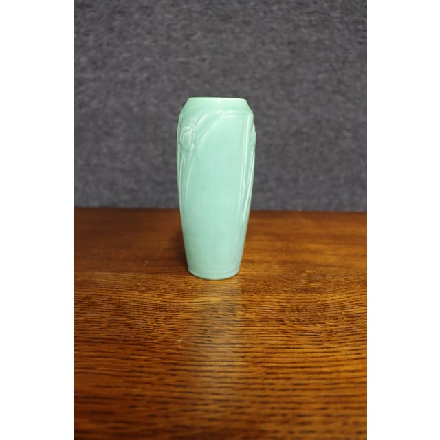 Rookwood Pottery vase dating to 1937, featuring a tall, softly tapered form with an architectural Art Deco silhouette. The...