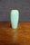 Rookwood Pottery vase dating to 1937, featuring a tall, softly tapered form with an architectural Art Deco silhouette. The...