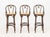 Set of Three Thonet Attributed Bentwood Bar Stools, with caned seats. 43" H x 18" W x 16.5" D; seat: 29.75" H. Provenance:...