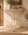 A characterful vintage demi-lune console table combining a decorative wrought iron base with a heavily distressed painted...