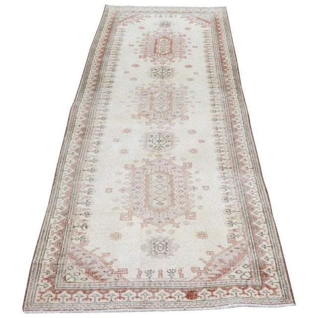 Hand-knotted with care using traditional rug-making techniques, this wool rug blends timeless craftsmanship with a modern...