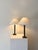 A pair of 20th century cast metal column lamps. These simple table lamps have subtle neoclassical and art deco design...
