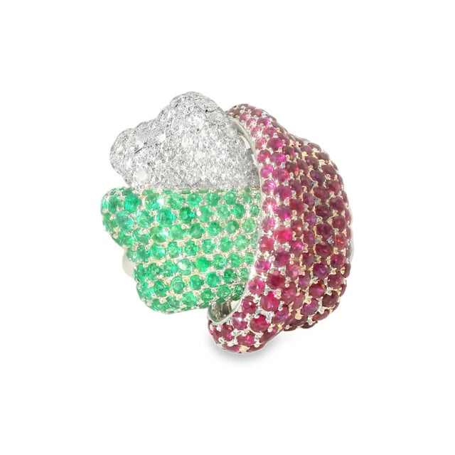 Stunning estate band ring crafted in 18K white gold, featuring a unique knot design adorned with sparkling diamonds,...