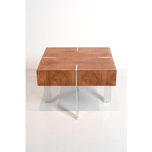 Postmodern side table made of wood veneer and aluminum legs. A sleek and firm design but easy to handle since it is nog...