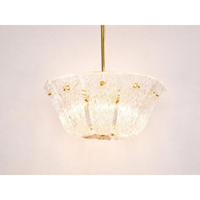 An elegant austrian mid-century modern brass chandelier from the 1950s, manufactured by j.t. Kalmar vienna, austria....