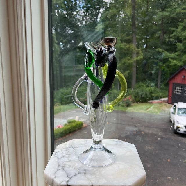 This exquisite vase by Borek Sipek for Driade is a stunning addition to any collection. The hand-blown glass production...