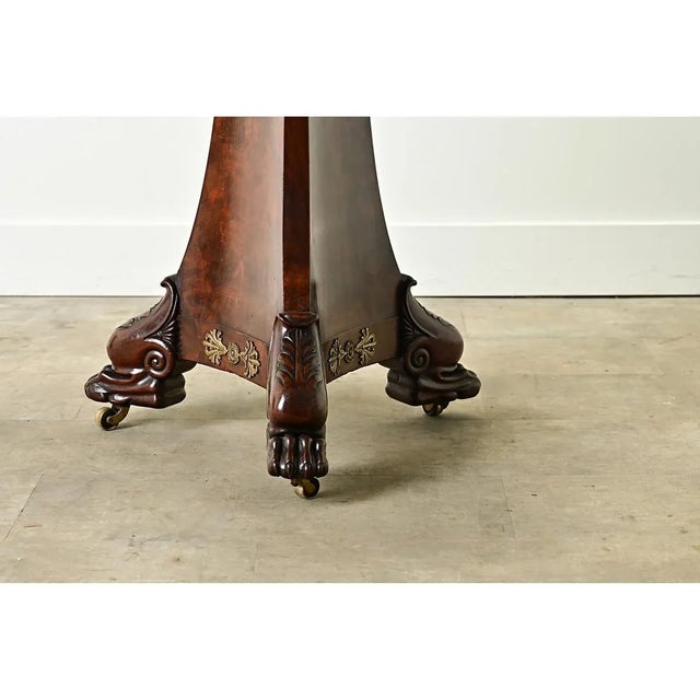 A gorgeous French marble-top, burled mahogany table from the Restauration period (19th century). This round pedestal table...