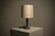 Pair of bobbin column table lamps by Harald Buchrucker, crafted in Germany in the 1960s. Its stacked bobbin form in tin...
