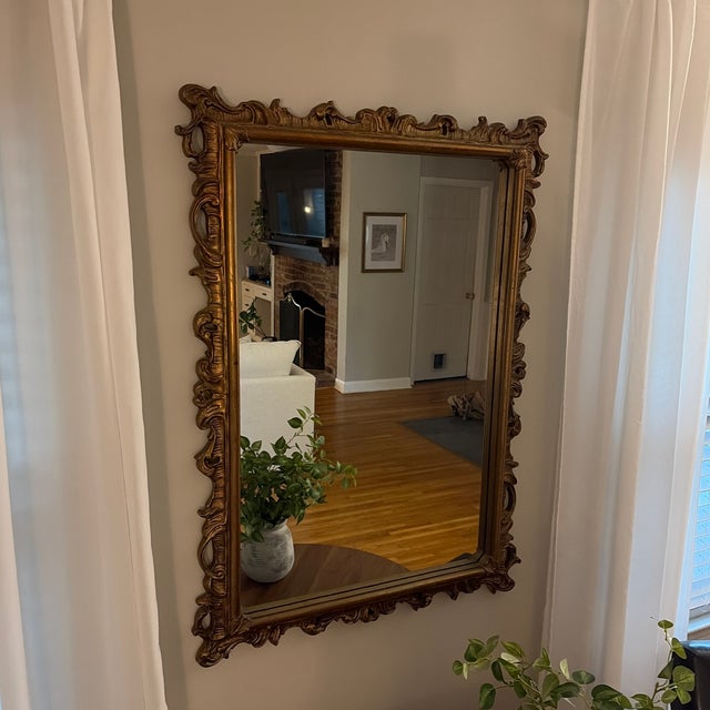 Bring timeless European character to your home with this beautifully detailed vintage Rococo Revival wall mirror....