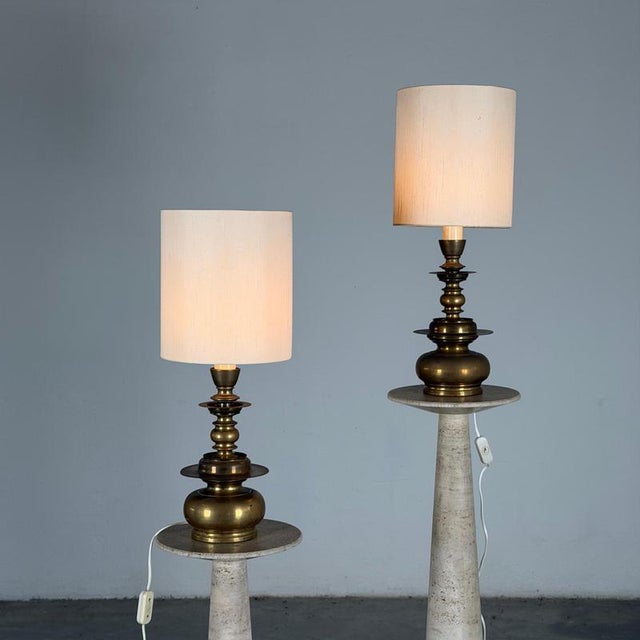 An impressive pair of sculptural wall lights produced in Italy by Mauritius in 1977, each example bearing the original...