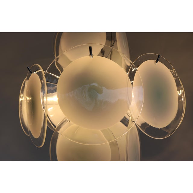 A stunning vintage murano glass chandelier by gino vistosi, crafted in italy during the 1970s. This elegant pendant lamp...