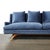 This Mid-Century Modernist sofa, upholstered in luxurious smoked sapphire blue velvet and featuring sculptural supports,...