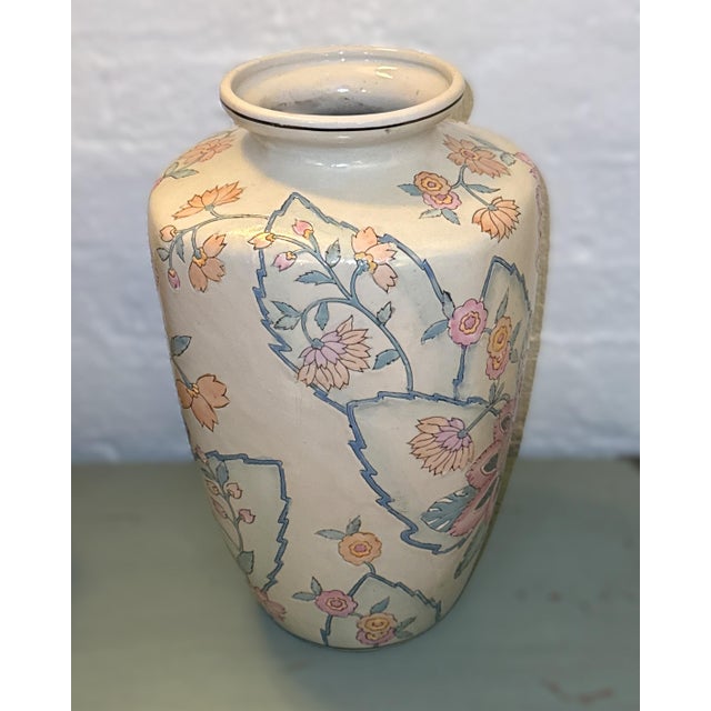 Vintage Chinese enameled porcelain urn shaped vase. Hand painted pastel lotus flowers with blue, green, purple and orange...
