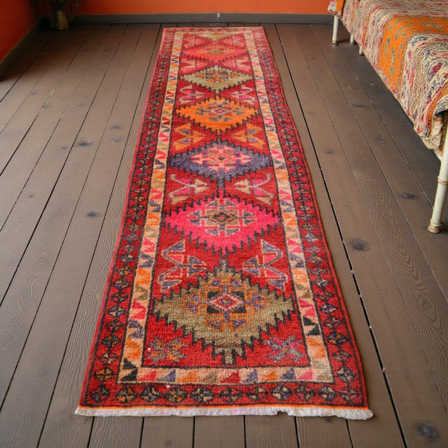 This masterfully hand-knotted Oushak runner originates from the Aegean region of Turkey, dating back to the 1960s. Woven...