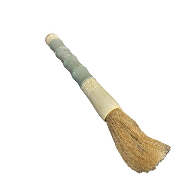 This striking large Chinese calligraphy brush features a jade color soapstone handle dyed amber and ox bone accents,...