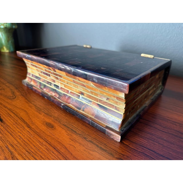Tessellated polished horn and brass jewelry box in a form of a book by Maitland Smith