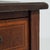 A refined Edwardian desk featuring a classic leather writing surface, combining practicality with understated elegance....