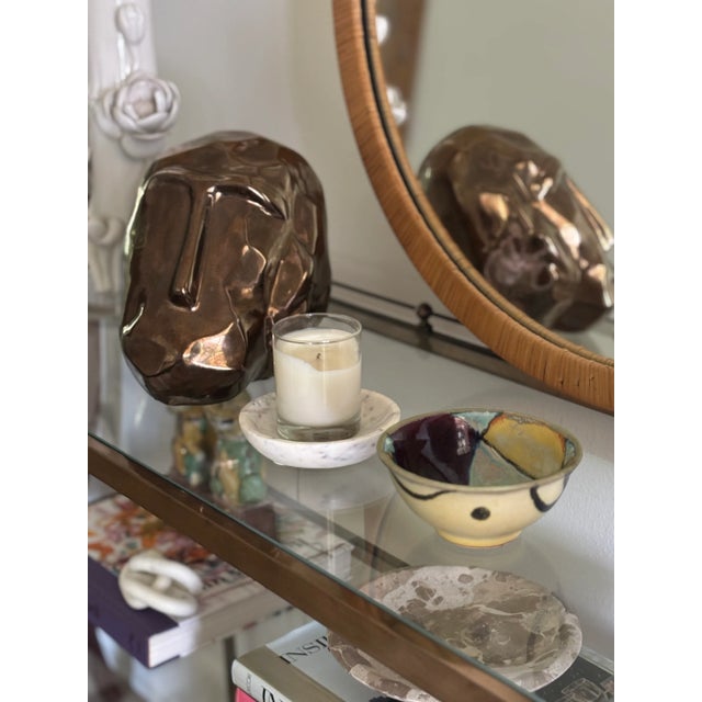 Small scale, studio pottery stoneware bowl with a high gloss glaze of bold color patches inside the bowl, with flowing,...