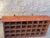Vintage industrial wooden sorting cabinet featuring 32 open compartments arranged in four rows. The cabinet retains a...