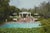 Poolside Drinks 1975 by Slim Aarons Slim Aarons Limited Estate Edition Guests around the pool at Dorothy Laughlin’s Santa...