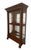 Handsome and striking, this solid wood and glass display cabinet is complete with beveled glass doors and glass shelves;...