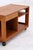 Vintage teak side table with a clean, compact design and four casters. The combination of a drawer and open compartments...