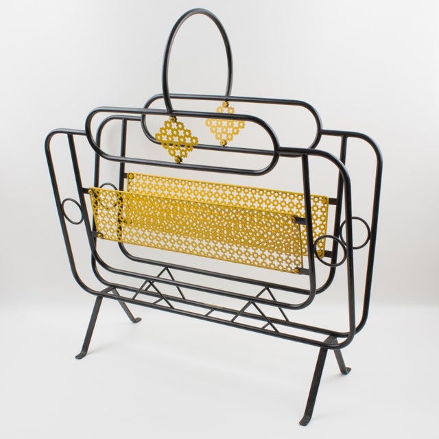 This stunning Mid-Century modernist magazine holder or rack is commonly attributed to Mathieu Matégot (1910-2001). This...