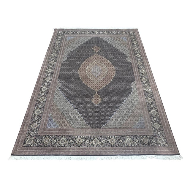 Fine Persian Tabriz Mahi Fish rug, hand knotted in Iran from 100% wool with silk highlights. Measuring 8’2” x 11’7”, the...
