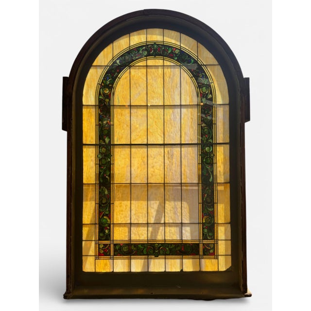 Seven original Victorian amber stained glass windows with floral border in jewel tones. Leaded glass panel set in a thick...
