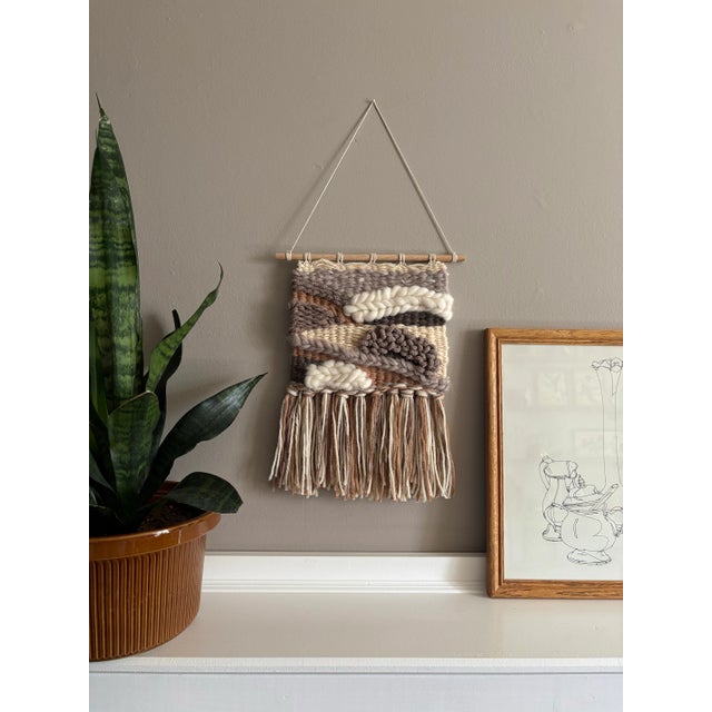 *Mesa Horizon* captures the rich textures and layers of the desert landscape. This piece blends warm beige, sand, and...